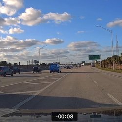 Deals on Wheels - Company vehicle crossing and cutting off merging traffic