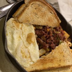 Colonial Pancake & Waffle House - Corned Beef Hash with a side of Rye Bread and 2 eggs over easy.
