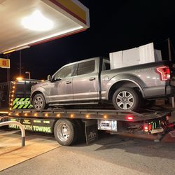 Dirty South Towing & Recovery - My truck being towed, making a pit-stop