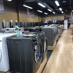Front load washers and dryers on display