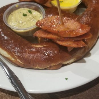 Copper Still Grill - Giant pretzel with bratwursts. - New American Near Me - Monrovia, California
