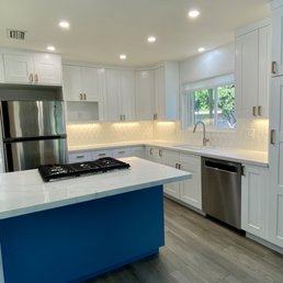 Cabinets were a light brown color before. His crew did an excellent job. Cabinets were a light brown color before. His crew did an excellent job.
