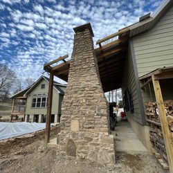 Crows Foot - Mountain stone fireplace adding warmth to an entertainment area
