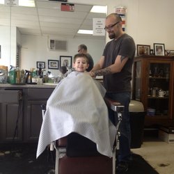 My son's first haircut by Ryan.