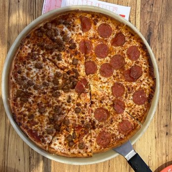 Ken's Pizza - a pepperoni pizza on a pan - Pizza Near Me - Sapulpa, Oklahoma