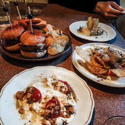 From top left clockwise: Artichoke sliders, madurat (goat cheese with truffle honey), garbanzo, stracciatella (buffalo mozarella) From top left clockwise: Artichoke sliders, madurat (goat cheese with truffle honey), garbanzo, stracciatella (buffalo mozarella)