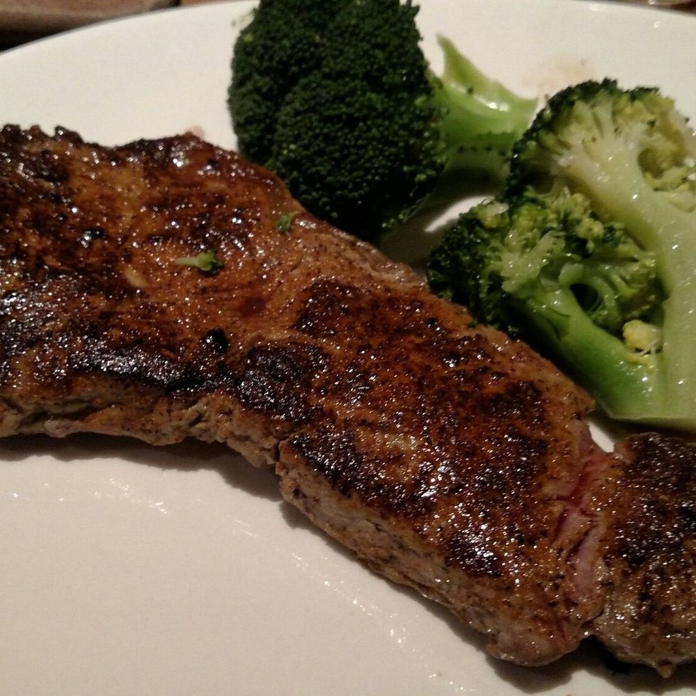 My strip steak was cooked to order but with bits of gristle. The broccoli looked good but was overcooked for my taste.