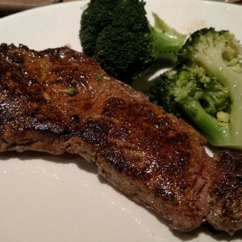 Outback Steakhouse - My strip steak was cooked to order but with bits of gristle. The broccoli looked good but was overcooked for my taste. - Steakhouses Near Me - Wappingers Falls, New York