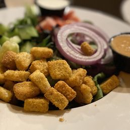 a plate of food with a salad and dipping sauce a plate of food with a salad and dipping sauce
