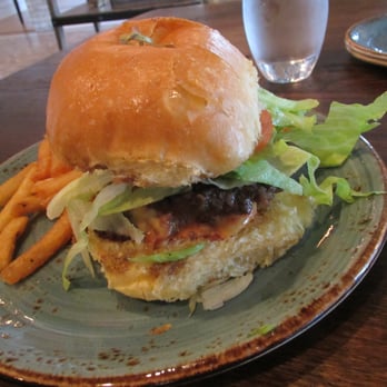 Tavern & Table - Juicy Lucy Burger: american cheese, lettuce, tomato, red onion, b&b pickles, brioche bun, duck fat fries; $14 - New American Near Me - Mt. Pleasant, South Carolina Tavern & Table - Juicy Lucy Burger: american cheese, lettuce, tomato, red onion, b&b pickles, brioche bun, duck fat fries; $14 - New American Near Me - Mt. Pleasant, South Carolina