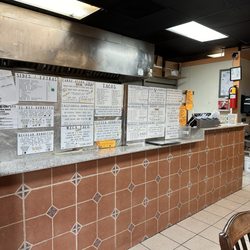 El Rey Taqueria - Interior with menu
