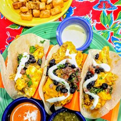 The Flying Biscuit Cafe - Three amigos tacos with home fries.
