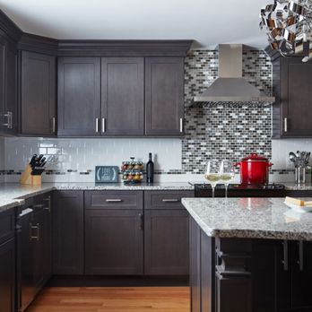 FSC Home Solutions - Dark brown shaker cabinets with granite counter tops. - General Contractors Near Me - Vero Beach, Florida FSC Home Solutions - Dark brown shaker cabinets with granite counter tops. - General Contractors Near Me - Vero Beach, Florida
