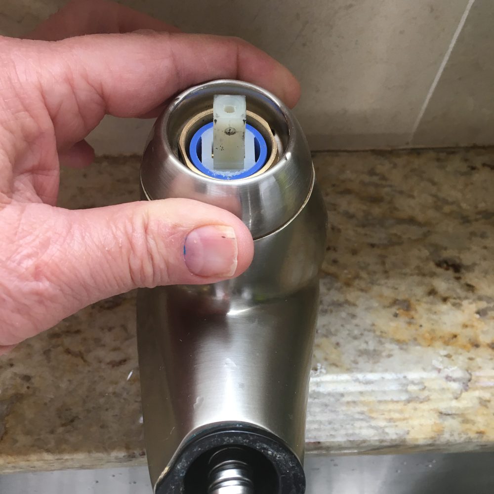 Removing decorative ring.  Cartridge visible.
