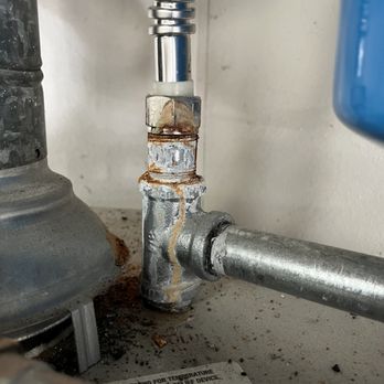 DH Plumbing - Corrosion on a thermal expansion galvanized fitting assembly - Plumbing Near Me
