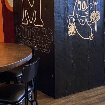 Mitzi's - a table and chairs in a restaurant - American Near Me - West Des Moines, Iowa Mitzi's - a table and chairs in a restaurant - American Near Me - West Des Moines, Iowa