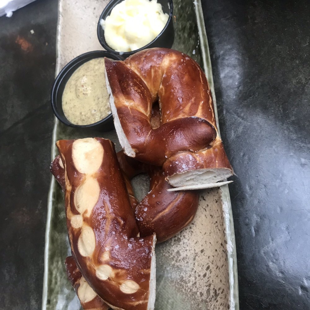Heights Bier Garten - Pretzel with a Dijon mustard and ramekin of butter - Cocktail Bars Near Me - Houston, Texas