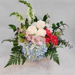The Flirty Flower - Blue hydrangea, white roses, red carnations, pink alstroemeria and white snapdragons.