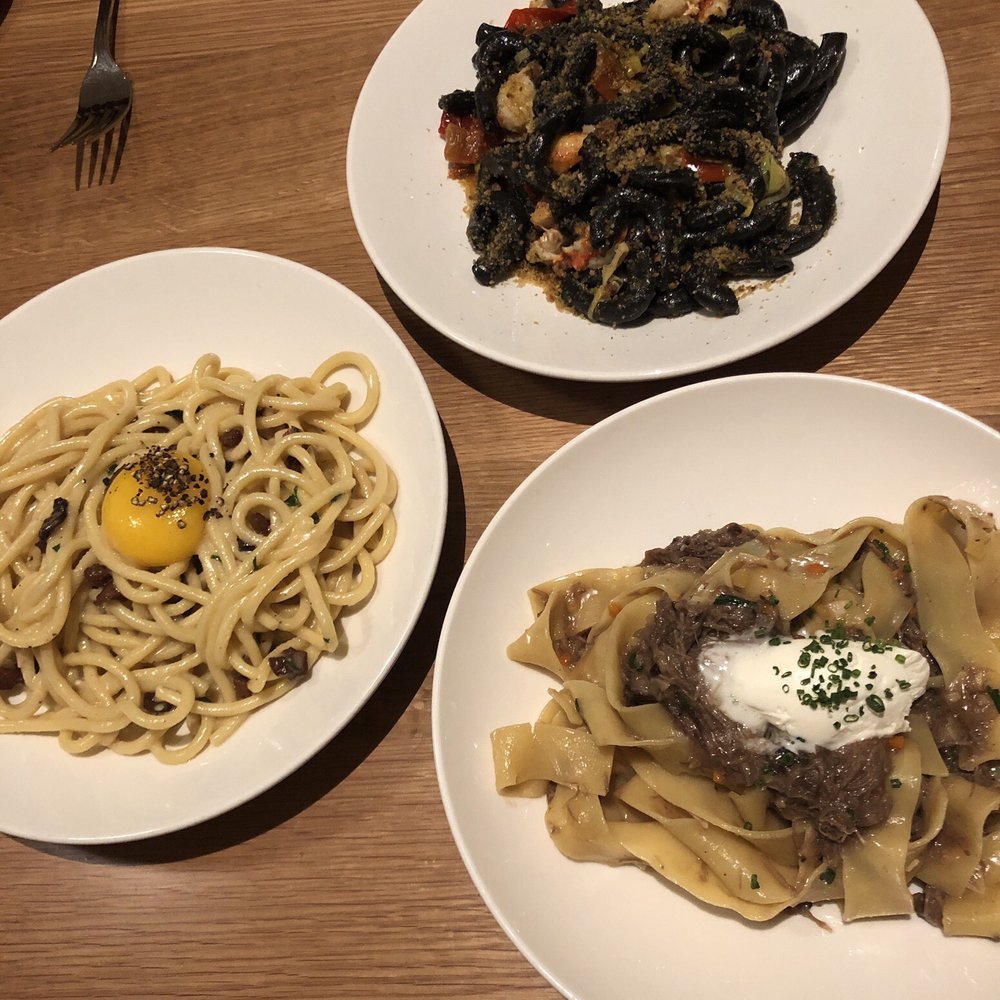 Cortina - Left to right: Carbonara, squid ink pasta, pappardelle. - Italian Near Me - Seattle, Washington