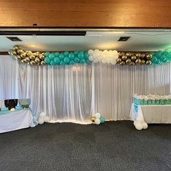 Drape backdrop with balloon garland