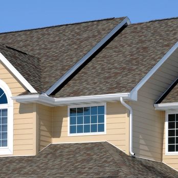 Protecta Roofing - A residential roof features a multi-toned brown and gray asphalt shingle system, contrasting with the light yellow siding and... - Roofing Near Me - San Marcos, California Protecta Roofing - A residential roof features a multi-toned brown and gray asphalt shingle system, contrasting with the light yellow siding and... - Roofing Near Me - San Marcos, California