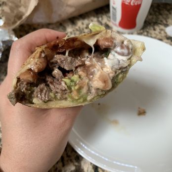 Photo of La Taqueria - San Francisco, CA, United States. Half of a super burrito with carne asada! So goooooood!