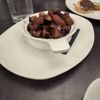 Hilltop Kitchen & Bar - Pork burnt ends. underneath were crispy onion. It was tasty but not a do over for me, but that's just a personal choice. - Wine Bars Near Me - Syosset, New York