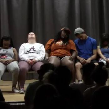 Hypnotist Jonathan Yeager - a group of people sitting on a stage - Comedy Clubs Near Me Hypnotist Jonathan Yeager - a group of people sitting on a stage - Comedy Clubs Near Me