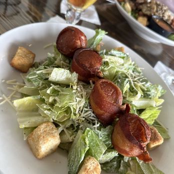 Nolan’s - Caesar salad with bacon-wrapped scallops as an "add-on" protein.  This is the best idea ever created by humans. - Seafood Near Me - Canandaigua, New York
