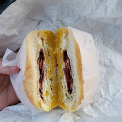 Lucky 7 Deli - Beautiful! Over medium eggs with cheese and well done turkey bacon.