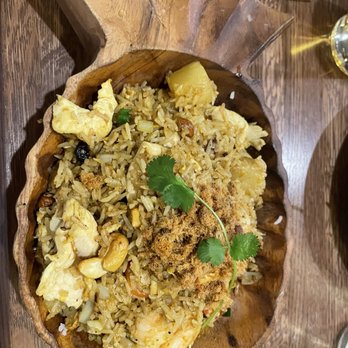 Tiki Thai - Pineapple fried rice in wooden pineapple bowl - Tiki Bars Near Me - Reston, Virginia Tiki Thai - Pineapple fried rice in wooden pineapple bowl - Tiki Bars Near Me - Reston, Virginia