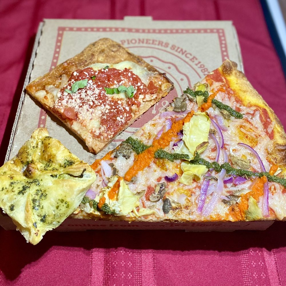 Spinach-artichoke bombini, Grandma Bess square and V For Vegan slice. Spinach-artichoke bombini, Grandma Bess square and V For Vegan slice.