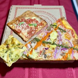 Spinach-artichoke bombini, Grandma Bess square and V For Vegan slice. Spinach-artichoke bombini, Grandma Bess square and V For Vegan slice.