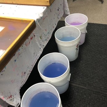 Copper Cat Studio - Buckets with colored water from the marbling process. - Art Classes Near Me - Reno, Nevada
