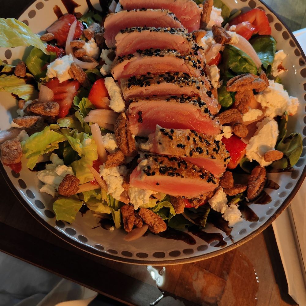 Noble Roots - Ahi tuna atop a salad with mixed greens, goat cheese, and candied pecans. - Wine Bars Near Me - Pooler, Georgia Noble Roots - Ahi tuna atop a salad with mixed greens, goat cheese, and candied pecans. - Wine Bars Near Me - Pooler, Georgia