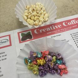 Popcorn Paradise - popcorn tasting. infront of us is jalapeno white cheddar and tutti fruiti.