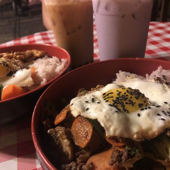 Koriente - Hers (bottom): Obake Bowl with Beef and Taro Milk Tea His (top): Spicy Chicken Bowl and Milk Tea - Asian Fusion Near Me - Austin, Texas