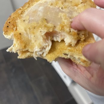 Arby's - a person holding a half eaten sandwich - Fast Food Near Me - Nashville, Tennessee