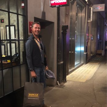 The Blind Pig - Entrance under red Opticians sign - Cocktail Bars Near Me - London, XGL The Blind Pig - Entrance under red Opticians sign - Cocktail Bars Near Me - London, XGL