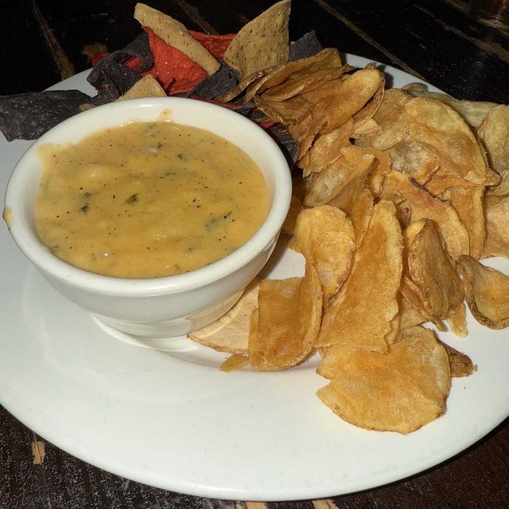 Dan McGuinness Pub - Queso dip. I wished the plate included some veggies. - Irish Pub Near Me - Southaven, Mississippi