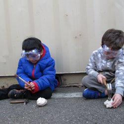 Kidstretch - Look at us being paleontologists, using hammers and brushes to uncover dinosaur bones.