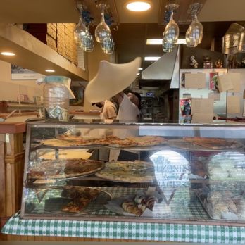 Vesuvios Pizzeria - a woman behind the counter - Pizza Near Me - Stuart, Florida Vesuvios Pizzeria - a woman behind the counter - Pizza Near Me - Stuart, Florida