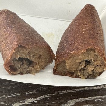 Pa'lla Voy Restaurant - Inside view Accapuria. Made with green plantains and ground beef. - Puerto Rican Near Me - Sanford, Florida