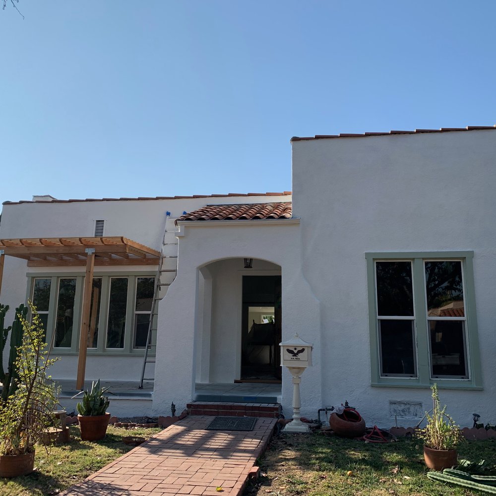 BuildSmart Construction - the front of a house with a cactus in the yard - General Contractors Near Me