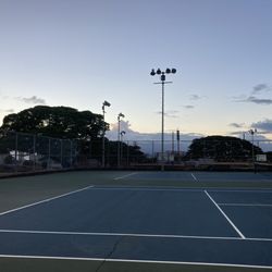 Kapaolono Community Park - Tennis courts with huge cracks overlooking the basketball courts and the pool