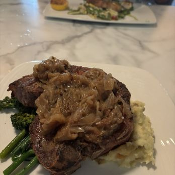 The Waterfront Restaurant & Tavern - Pork T-bone - New American Near Me - La Crosse, Wisconsin The Waterfront Restaurant & Tavern - Pork T-bone - New American Near Me - La Crosse, Wisconsin