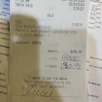 Smokey Bones - I put on the total lines 130.... I left the 98 cents off... I put in the tip line 000. - Barbeque Near Me - Maumee, Ohio