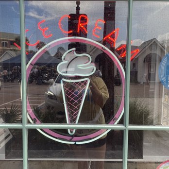 Smallcakes 30A - a reflection of a woman in a shop window - Cupcakes Near Me - Seacrest Beach, Florida Smallcakes 30A - a reflection of a woman in a shop window - Cupcakes Near Me - Seacrest Beach, Florida