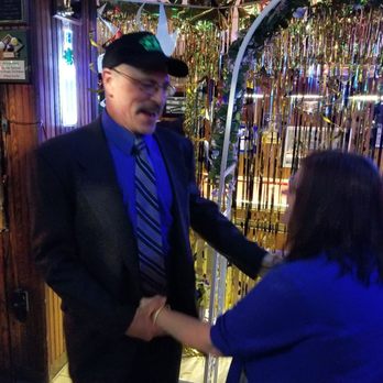 O'neary's Irish Pub - a man in a suit and tie shaking hands with a woman - Pizza Near Me - Brainerd, Minnesota O'neary's Irish Pub - a man in a suit and tie shaking hands with a woman - Pizza Near Me - Brainerd, Minnesota