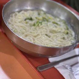 a bowl of noodles on a tray